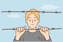 پیش‌نمایش فایل sad-boy-looking-out-from-wire-fence-8633050 از پک متفرقه