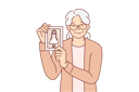 پیش‌نمایش فایل elderly-woman-shows-photo-of-little-girl-and-smiles-10616417 از پک فعالیت افراد